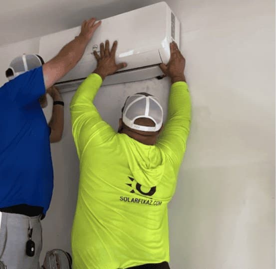 SolarFIX technicians mounting a mini split indoor unit