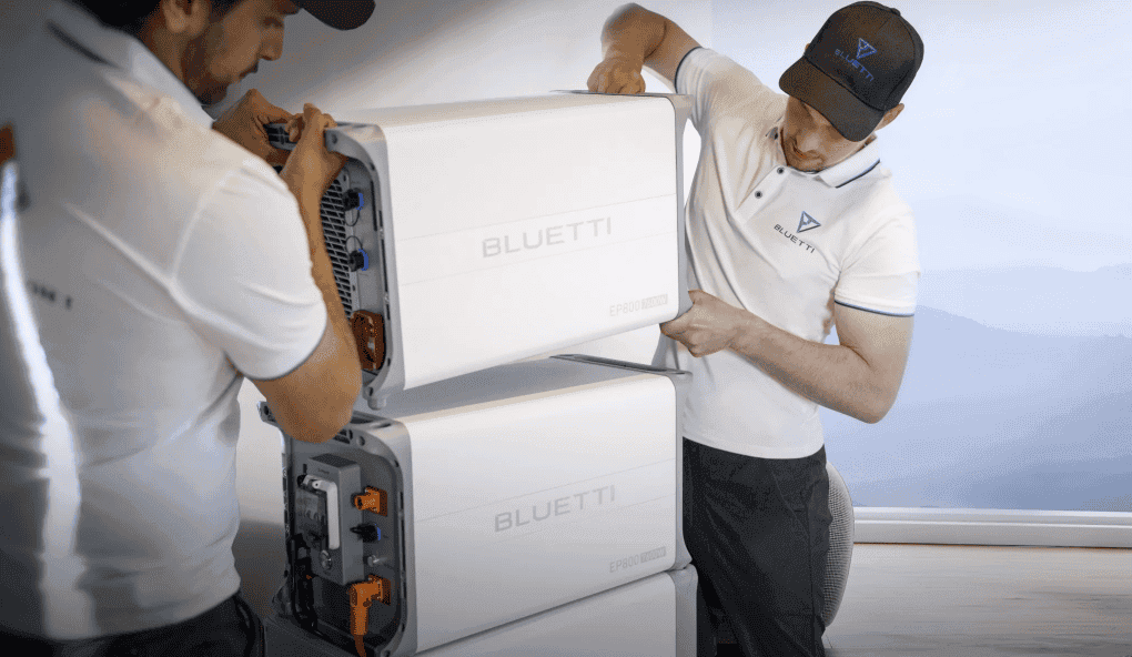 Installers setting up a home battery system
