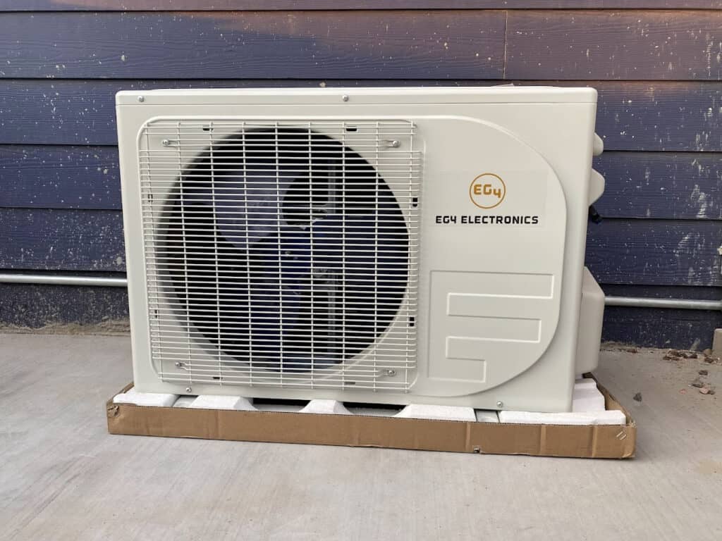 Mini split outdoor unit on its pad
